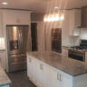 White kitchen with island, pendant lights, and stainless appliances, JL Home Builders, Pittsburgh