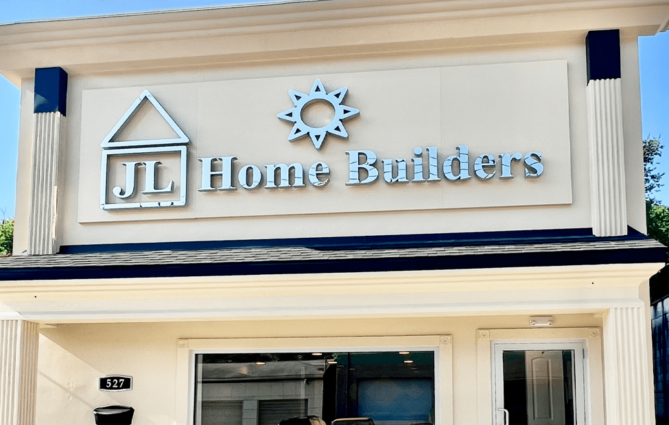 JL Home Builders storefront with logo, featuring a house icon and sun, located at 527 McNeilly Rd, Pittsburgh, showcasing the company's commitment to quality home renovations and personalized service.