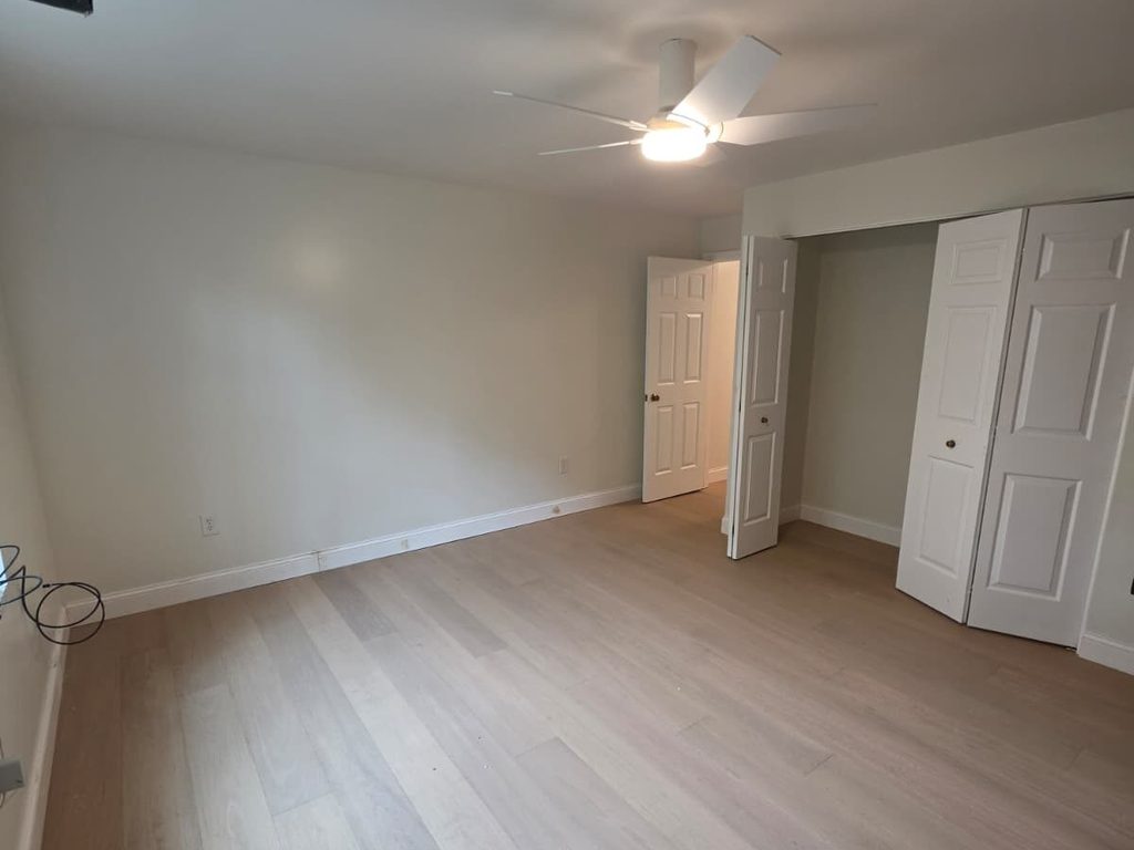 Bedroom with new hardwood flooring and closet doors, JL Home Builders, Pittsburgh