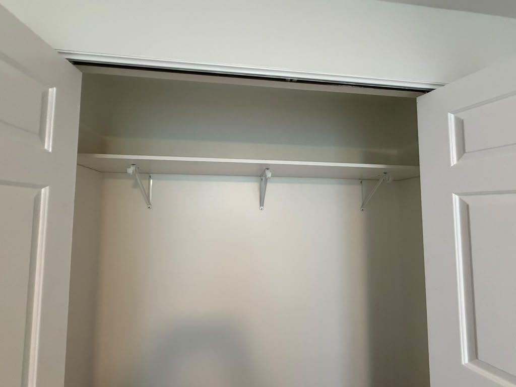 Bifold closet with a shelf and rod, JL Home Builders, Pittsburgh