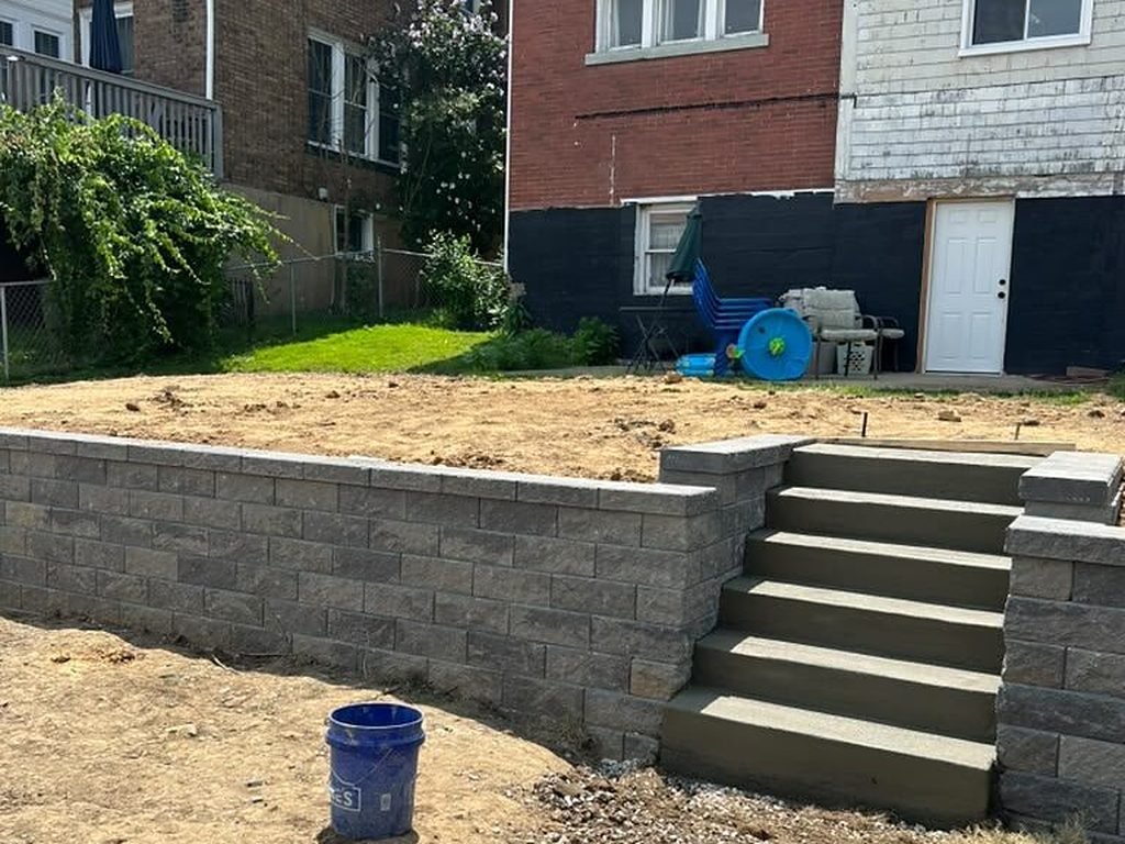 Block retaining wall with new concrete steps on a Pittsburgh hillside lot, JL Home Builders