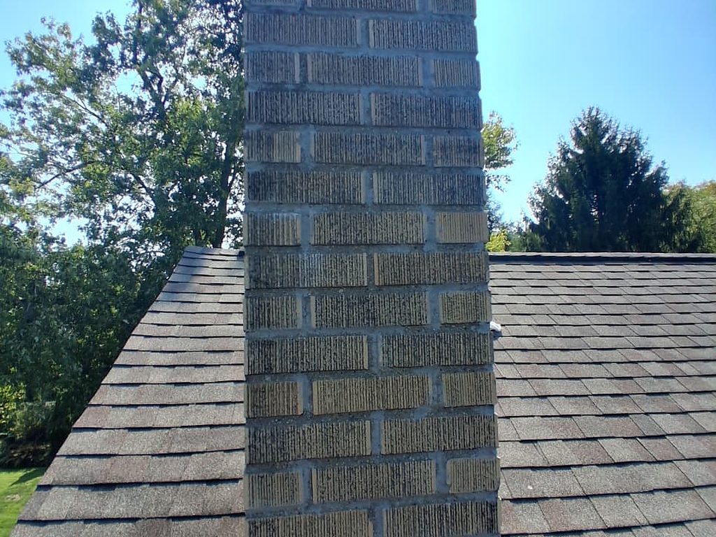 Repointed brick chimney on a shingle roof, JL Home Builders, Pittsburgh