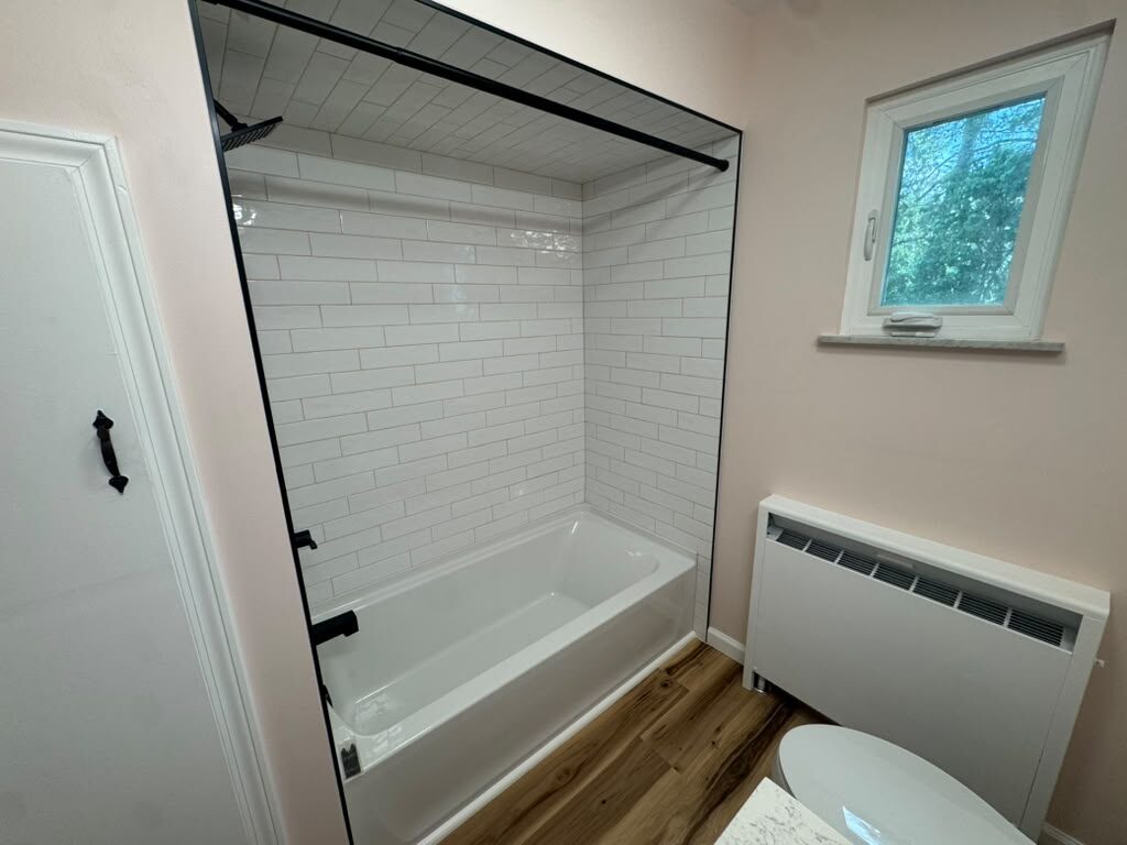 Completed tub surround, window, and flooring, JL Home Builders, Pittsburgh