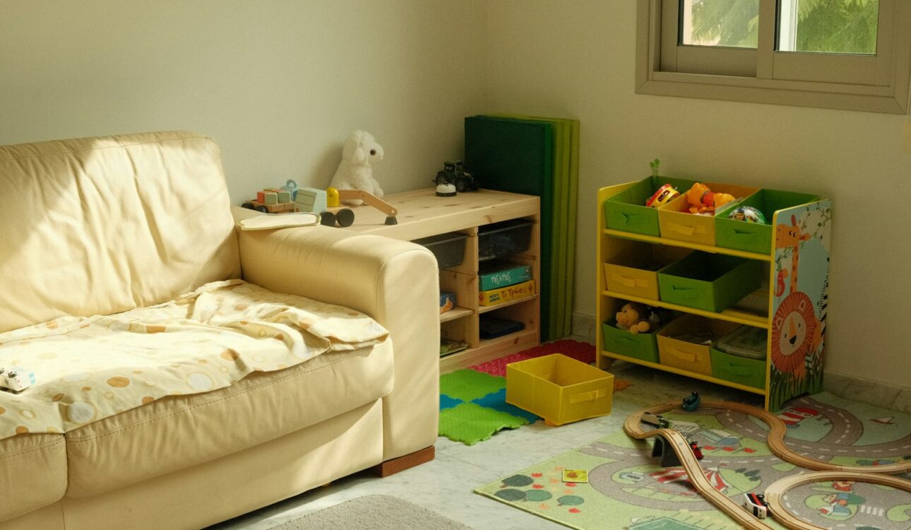 Family playroom with a couch and toy storage