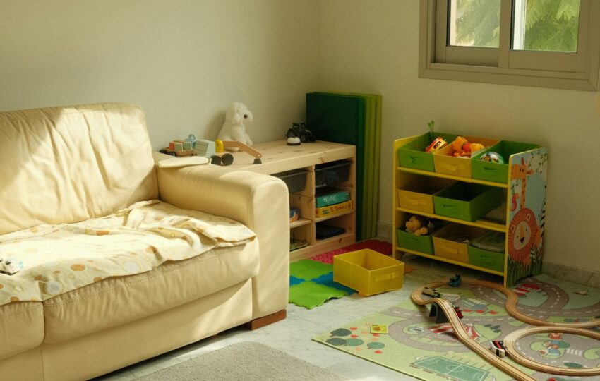 Family playroom with a couch and toy storage