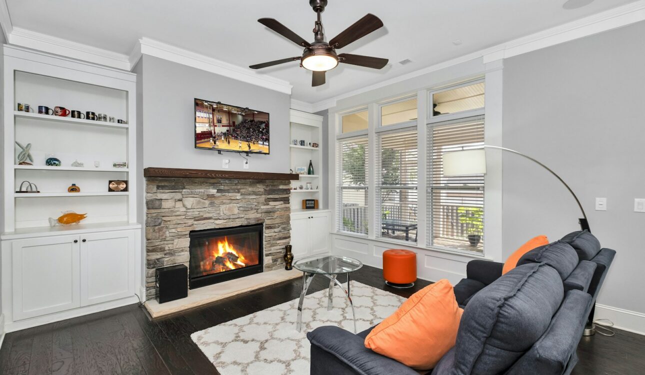Finished basement family room with fireplace and sectional