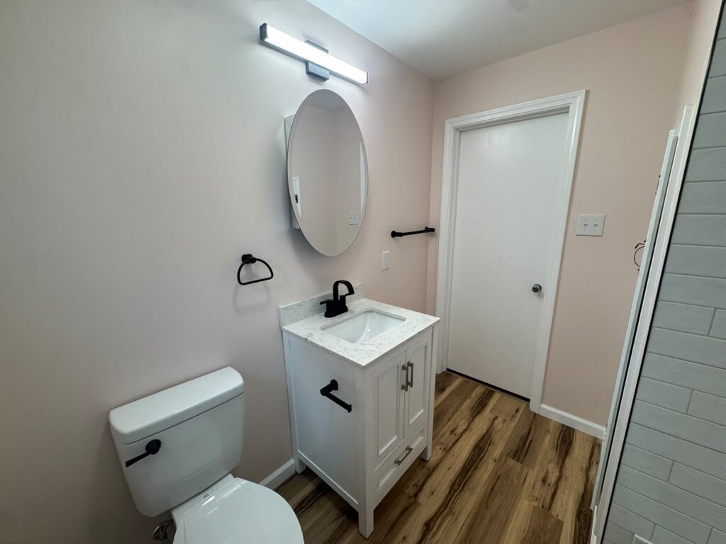 Finished bathroom vanity with mirror and matte black fixtures, JL Home Builders, Pittsburgh