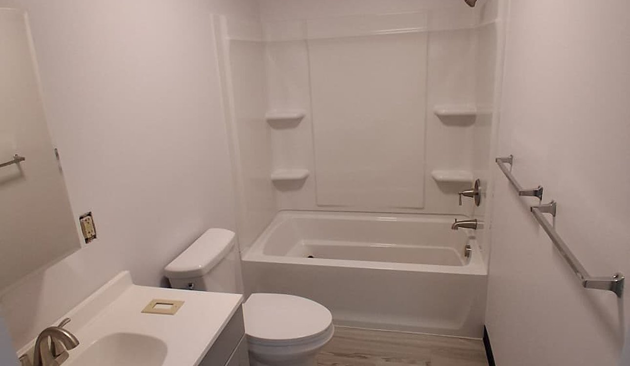 Finished Bathroom With Tub Surround And Vanity by JL Home Builders, Pittsburgh