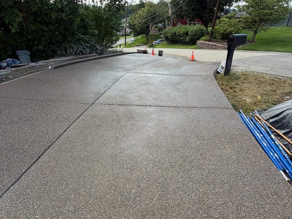 Finished exposed aggregate driveway meeting the street, JL Home Builders, Pittsburgh