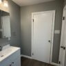 Finished Gray Bathroom With White Vanity by JL Home Builders, Pittsburgh