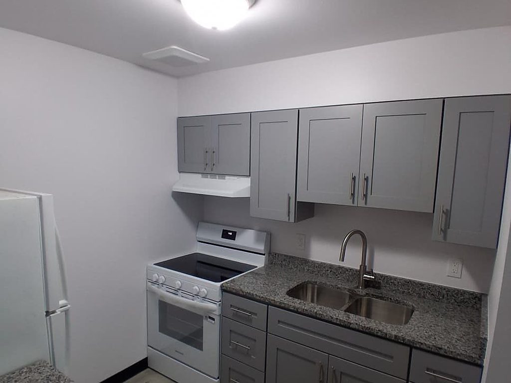 Finished gray shaker kitchen with granite counters, JL Home Builders, Pittsburgh