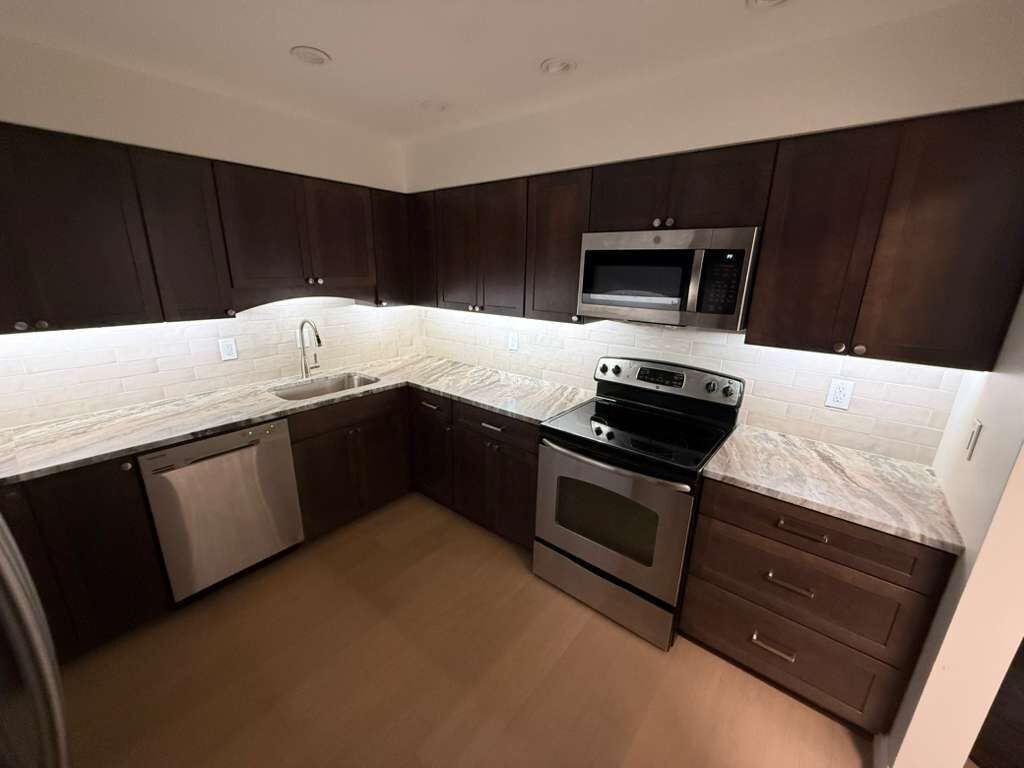 Finished kitchen with dark cabinets, granite counters, and subway tile backsplash, JL Home Builders, Pittsburgh