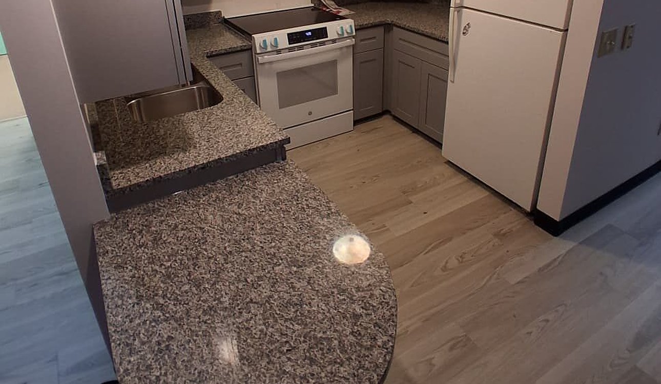 Finished Kitchen With Granite Peninsula And Fridge by JL Home Builders, Pittsburgh