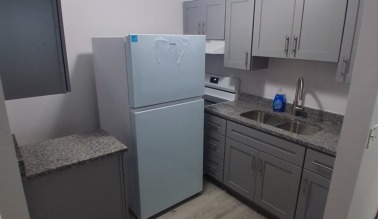Finished Kitchen With Refrigerator And Sink Run by JL Home Builders, Pittsburgh