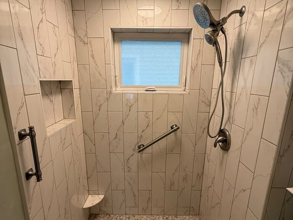 Finished marble-look tile shower with a built-in niche, JL Home Builders, Pittsburgh