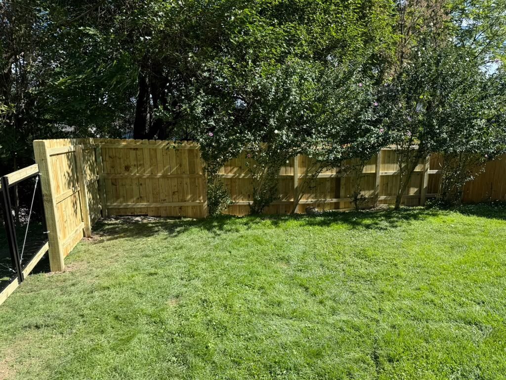 Finished privacy fence with a gate in a Pittsburgh backyard, JL Home Builders