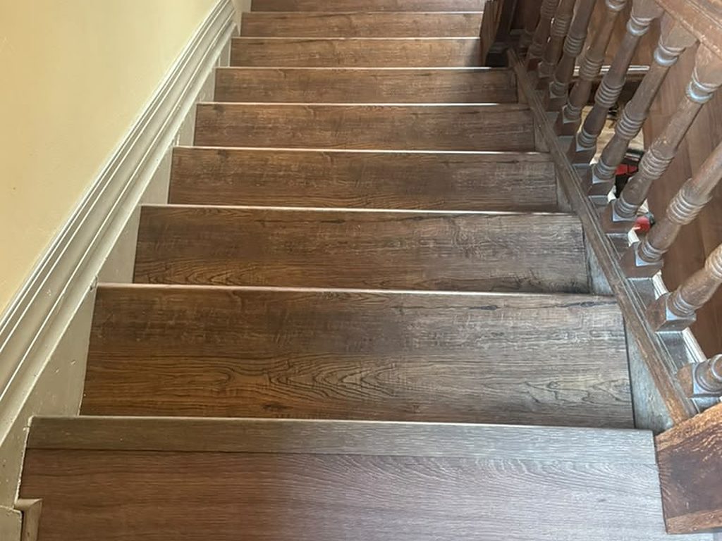 Refinished staircase in an older Pittsburgh home, looking down from the landing, JL Home Builders