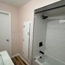 Finished Subway Tile Tub With Black Fixtures by JL Home Builders, Pittsburgh