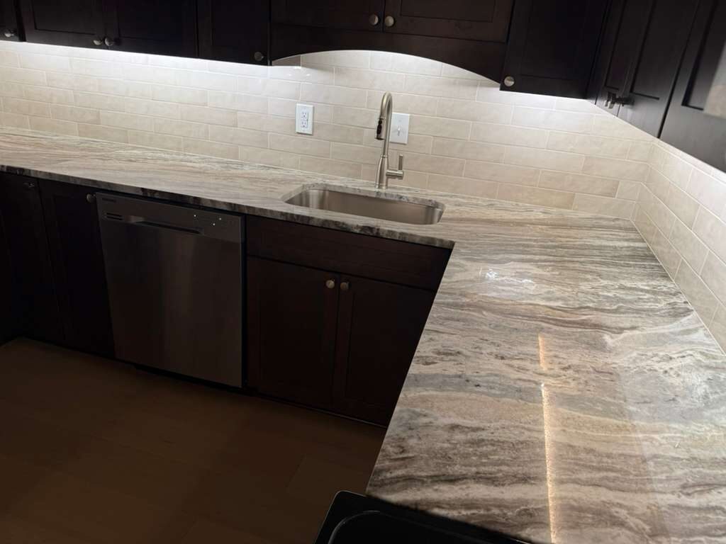 Granite countertop and tile backsplash detail at the sink, JL Home Builders, Pittsburgh