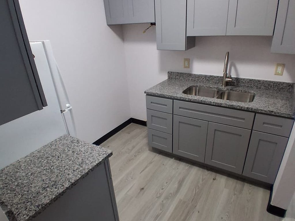 Gray shaker kitchen with granite countertop and sink, JL Home Builders, Pittsburgh
