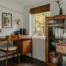 Home office with a wood desk beside a window