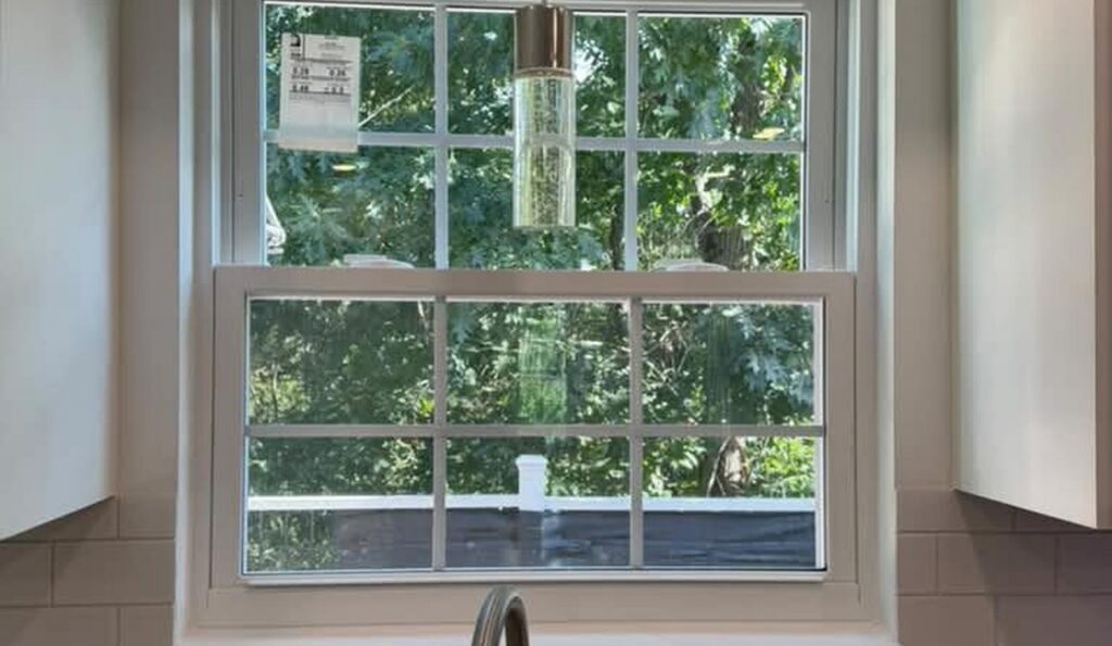 Kitchen sink window with subway tile and pendant light, JL Home Builders, Pittsburgh