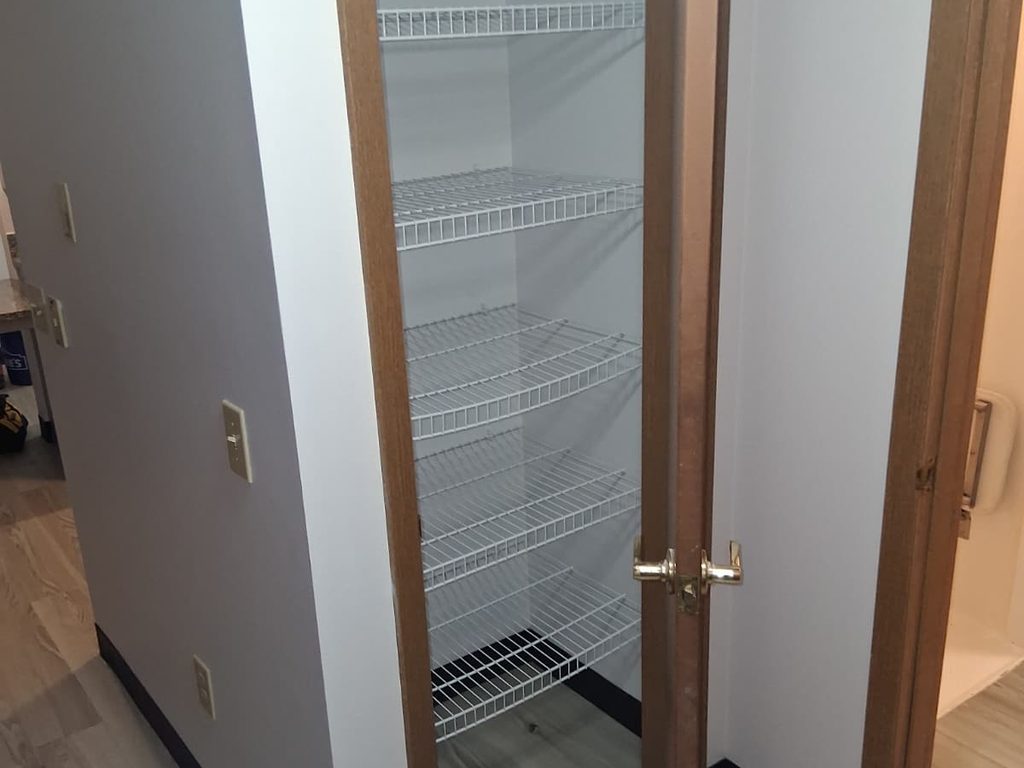 Linen closet with wire shelves and new flooring, JL Home Builders, Pittsburgh
