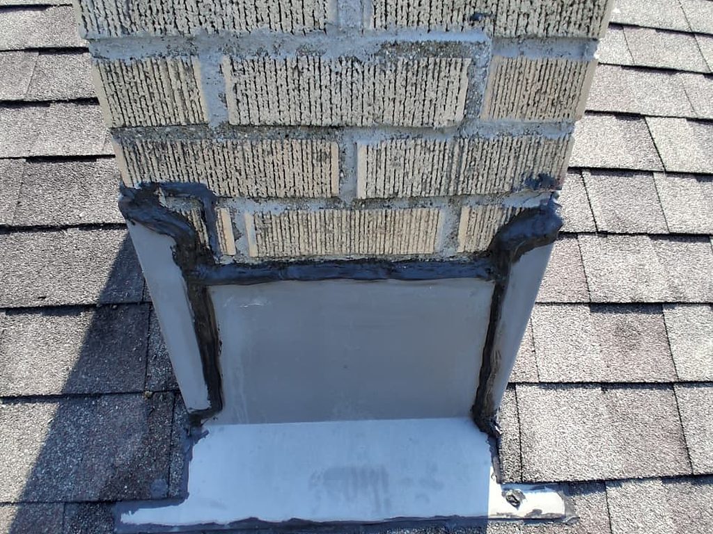 New chimney flashing sealed at the roofline, JL Home Builders, Pittsburgh