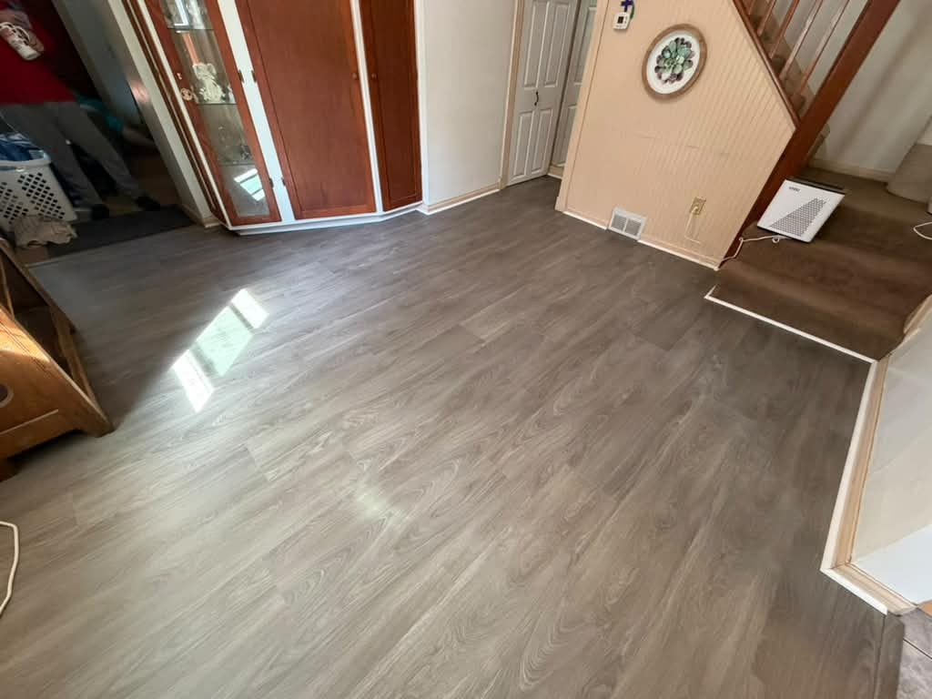 New gray vinyl plank flooring in a living room, JL Home Builders, Pittsburgh