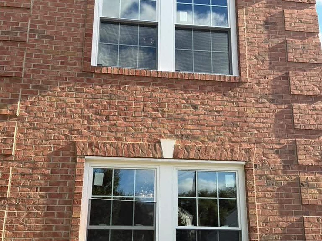 New grid windows set in a brick facade, JL Home Builders, Pittsburgh