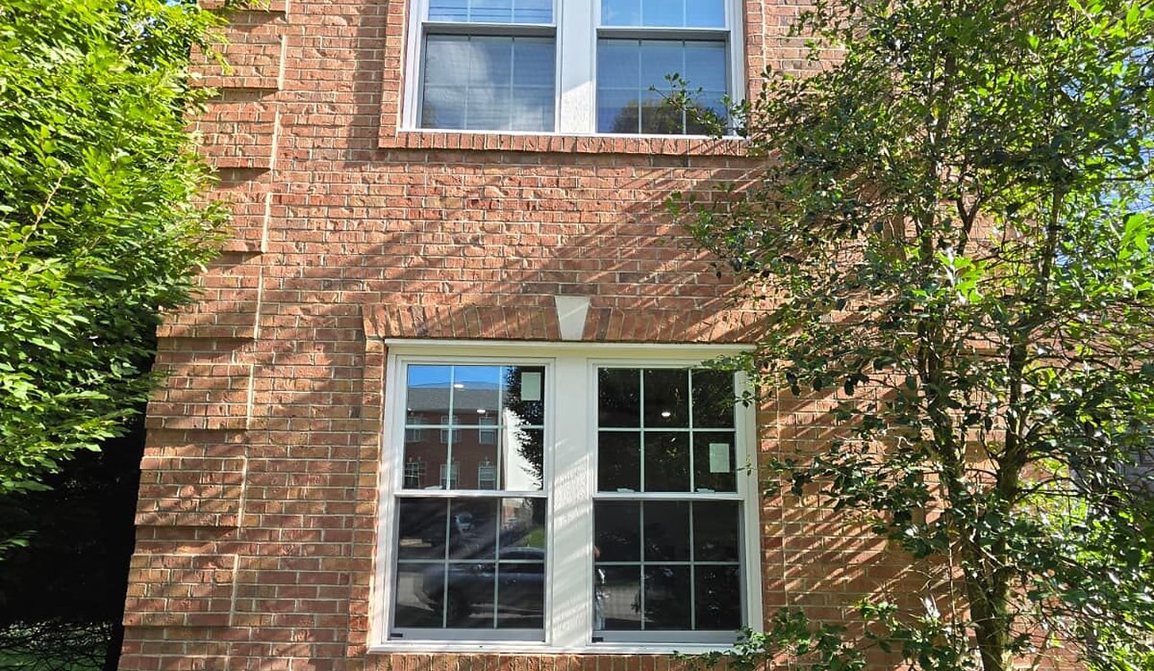 New Grid Windows On Brick Home Exterior by JL Home Builders, Pittsburgh