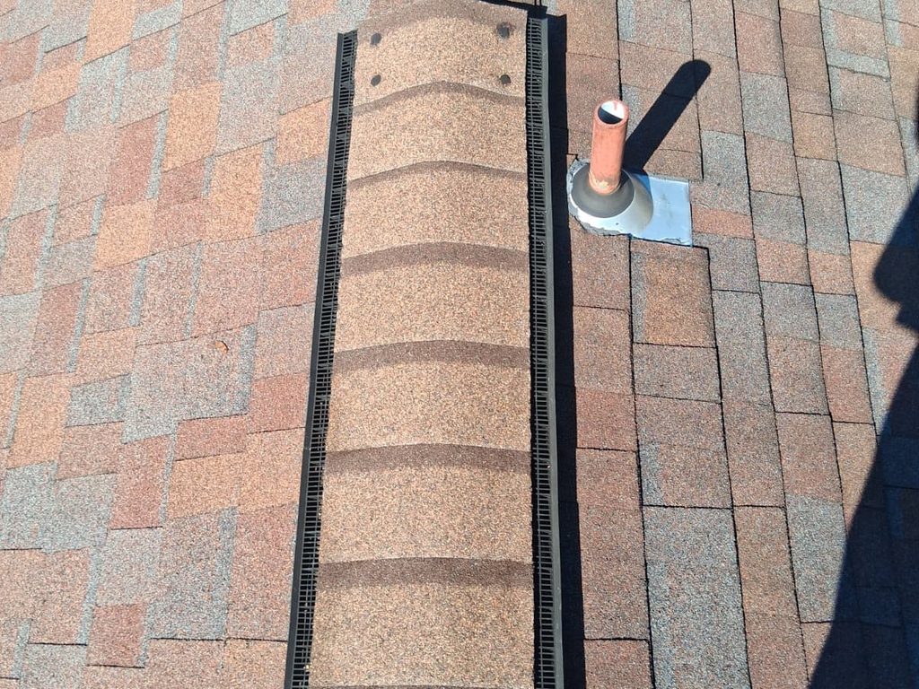 New ridge cap shingles installed over a ridge vent, JL Home Builders, Pittsburgh