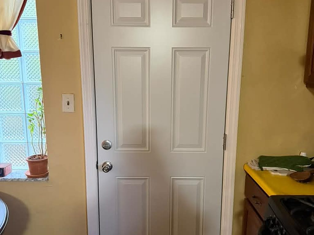 New six-panel steel door installed in a kitchen, JL Home Builders, Pittsburgh