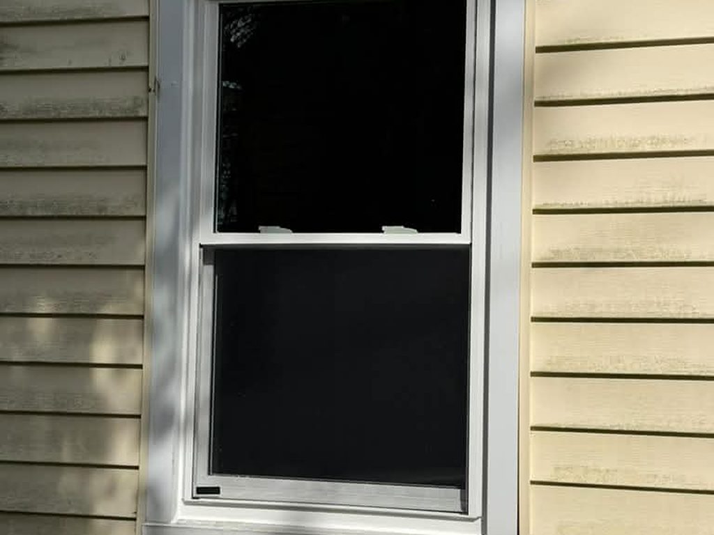 New white replacement window in yellow siding, JL Home Builders, Pittsburgh