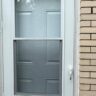 New White Storm Door On Brick Exterior by JL Home Builders, Pittsburgh