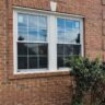 New White Windows Installed In Brick Exterior by JL Home Builders, Pittsburgh