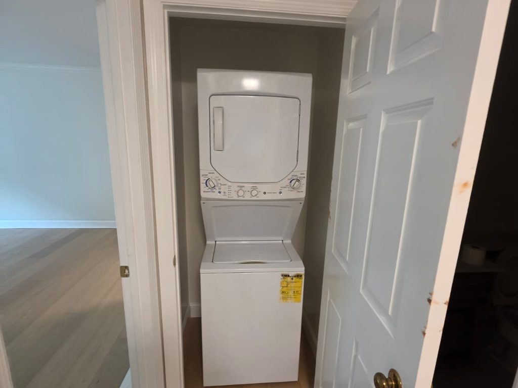 Stacked washer and dryer closet with new flooring, JL Home Builders, Pittsburgh