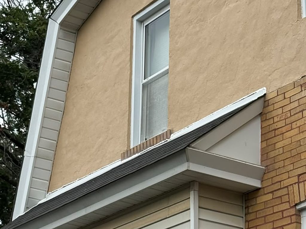 Gable end with new siding, soffit, and gutter on a Pittsburgh home, JL Home Builders