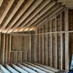 Framed walls, sheathing and roof rafters inside a room under construction, JL Home Builders, Pittsburgh