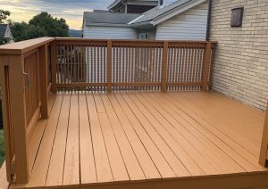 Stained wood deck with railings built by JL Home Builders, photo 1
