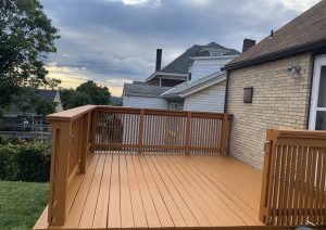 Stained wood deck with railings built by JL Home Builders, photo 2
