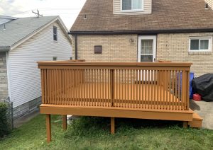 Stained wood deck with railings built by JL Home Builders, photo 3