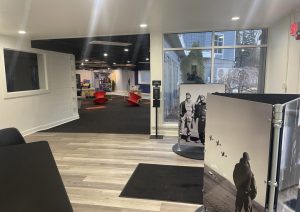 Aviation themed entry area with runway carpet and pilot exhibit