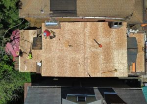 Bare plywood decking installed across the roof before the new roofing went on