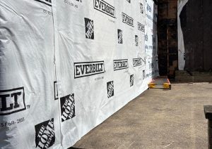 Side wall of the addition wrapped in house wrap