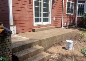 Flagstone path leading to exposed aggregate steps