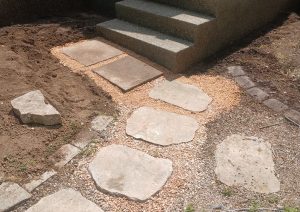 Flagstone steps and path beside a new concrete landing