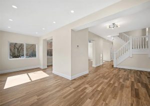 Bright, modern interior of a recently renovated home in Etna, featuring new hardwood flooring, fresh neutral paint, updated lighting fixtures, and an open layout with ample natural light.